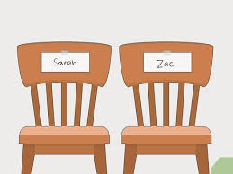 2 cartoon chairs side by side, with the name Sarah on one, and Zac on the other one