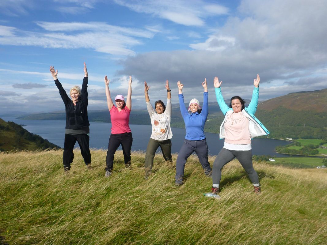 Picture: 5 women stand on top of a mountain - a demonstration in how to achieve your goals using NLP.